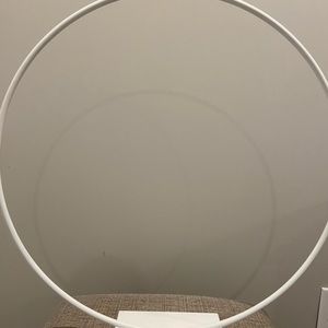 Cake hoop used for 3 tier cake made of iron and painted white. Has a sturdy base